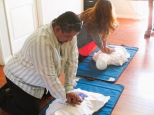 Practicing CPR on a mannequin